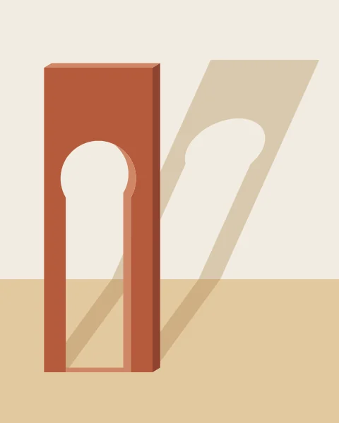 A freestanding terracotta horseshoe arch stands in late sun, throwing a long shadow across the floor and up a plaster wall.