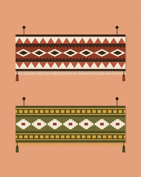 Woven runners with fringed ends and tassels hang from pegs on a clay wall, each with its own bands of lozenges, ladders and combs.