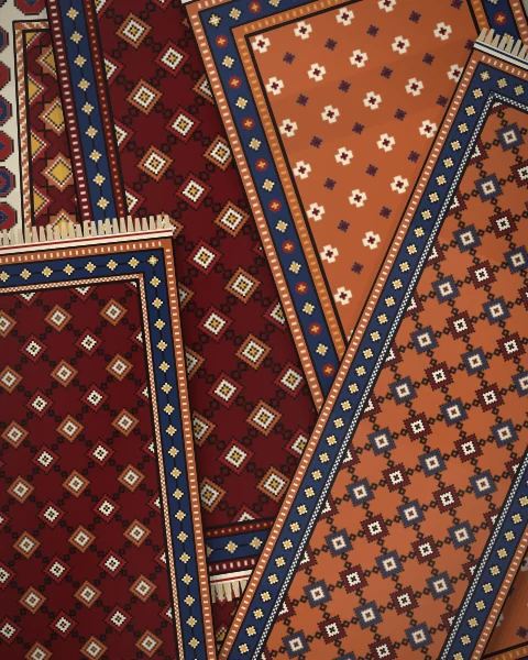 A loose scatter of black, deep madder and rust rugs at every angle, most of them fields of latch-hook diamonds and Memling guls.
