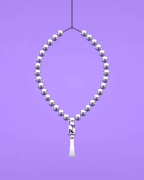 A loop of thirty-three chrome prayer beads hangs from a fine cord, gathered at the bottom by a longer bead and a tassel, on a lilac ground.