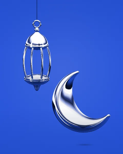 A chrome lantern hangs beside a floating chrome crescent on a deep cobalt ground.