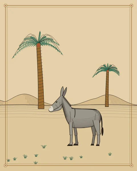 A grey donkey with a pale muzzle standing on open ground between two date palms, low hills beyond.