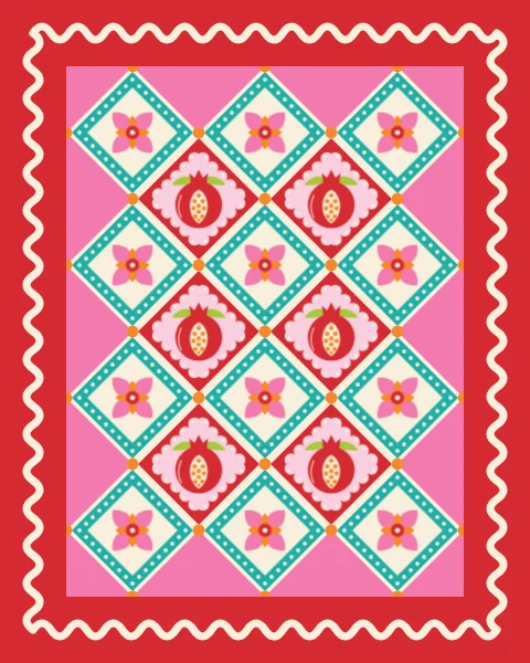 Pomegranates split to show their seeds alternate with four-petal flowers across a blush quilt bound in red with rickrack.