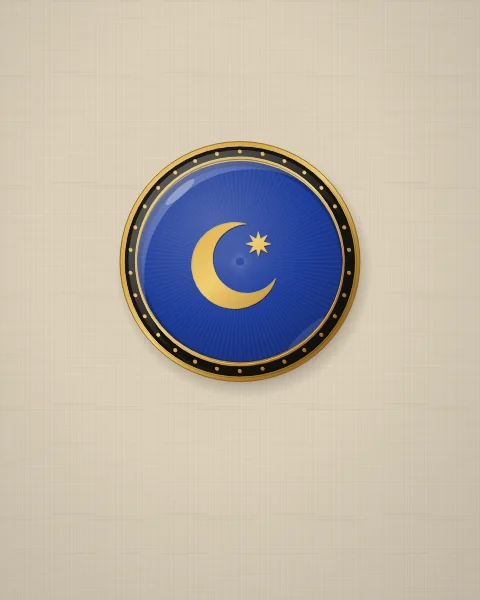 A small cobalt enamel plate with a gold crescent and star over fine engine-turned rays, set on plain natural linen.
