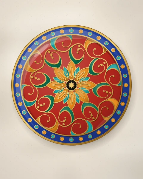 A carnelian enamel plate with a large saffron and turquoise flower at its centre, circled by a gold scroll of emerald leaves, inside a cobalt rim of beads.