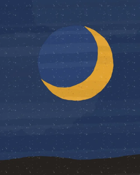 A saffron crescent cradles the faint disc of the rest of the moon, lit by earthshine, in a deep indigo sky above a low dark hill.