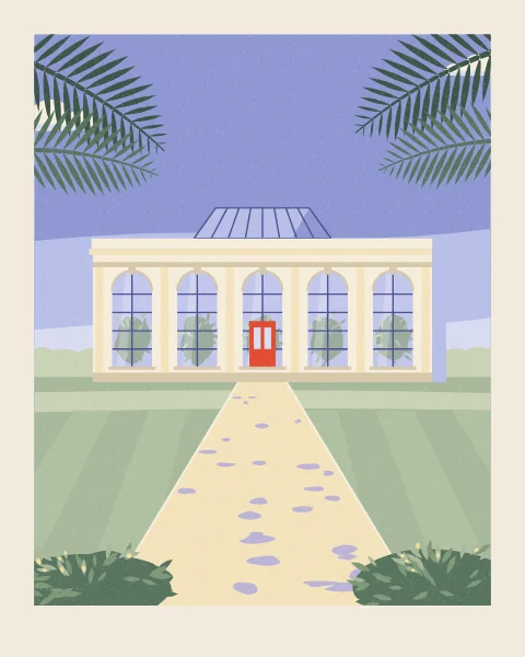 A cream stone orangery with tall arched windows, a red door and a glass roof lantern stands across a lawn, with date-palm fronds hanging into the top of the view.