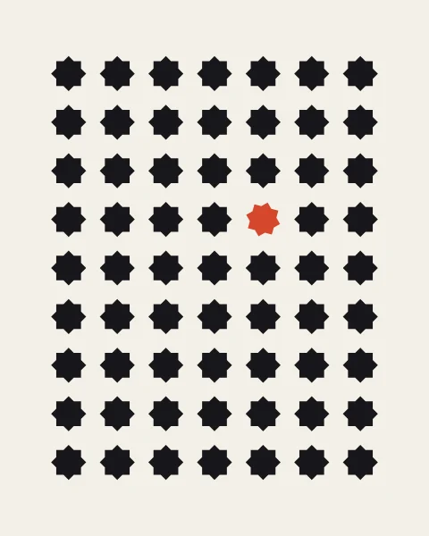 A tidy grid of small black stars in which a single vermilion star has turned a few degrees.