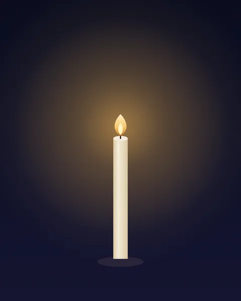 A single tall cream candle standing in a dark room, its flame lit and its glow the only warmth on an almost black indigo ground.