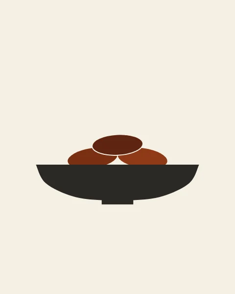 Three dates in deep browns rest in a shallow charcoal bowl on a narrow foot, set in the middle of a pale paper ground.