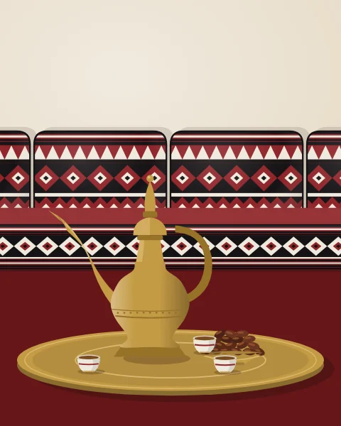 A brass dallah, small finjan cups and a bowl of dates sit on a round tray in front of sadu-woven floor cushions.
