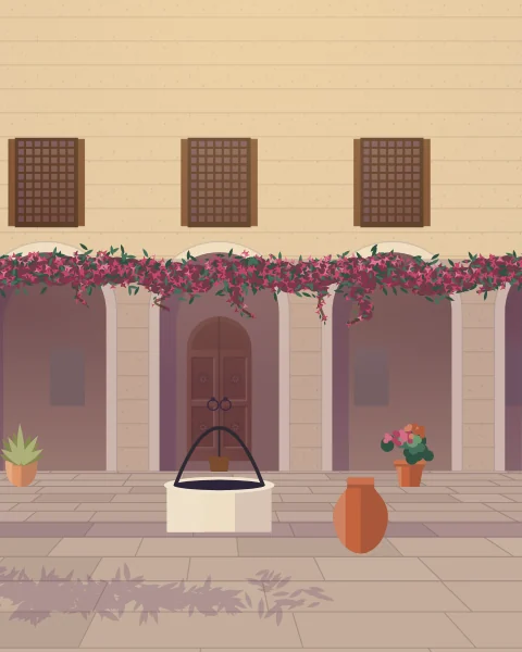 A stone well with an iron arch and bucket in a flagged courtyard, potted plants along the arcade and the evening shade creeping across the floor.