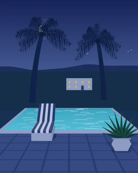 A lit pool glowing turquoise in the blue hour after sunset, palms in silhouette and the windows of the house warm with light.