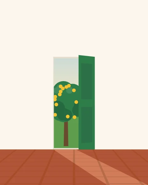 A green door standing half open in a white wall, a slice of lemon tree and sunlight showing through.