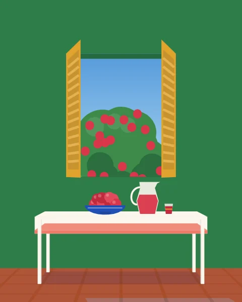 A bowl of pomegranates and a jug of their juice on a table by a green window, a pomegranate tree in fruit outside.
