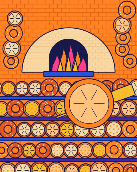A domed oven with its fire lit, surrounded by racks of round loaves and rings, with a loaf on a wooden peel.