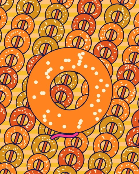 Rings of sesame bread heaped edge to edge, with one large ring at the centre.