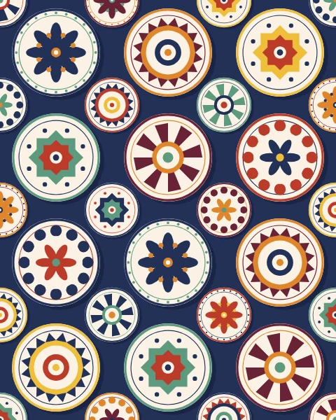 Painted ceramic plates of two sizes hung edge to edge, each glazed with rosettes, stars and bands of colour.