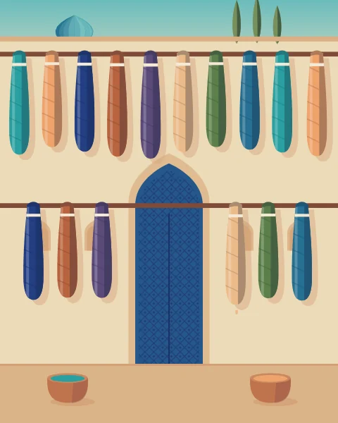 Skeins of freshly dyed silk in turquoise, indigo, apricot and madder hang from poles in a courtyard beside a blue door, with dye vats below.