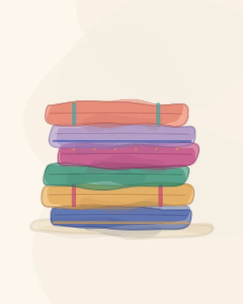 A neat stack of folded fabrics in cobalt, saffron, emerald, magenta, lilac and coral, some with woven stripes and borders.