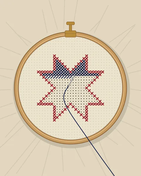 A star held taut in a wooden embroidery hoop with a brass screw clamp. The madder outline is worked, the indigo fill is coming down from the top, the rest is marked in pencil, and the working thread runs across the ring and off the sheet.