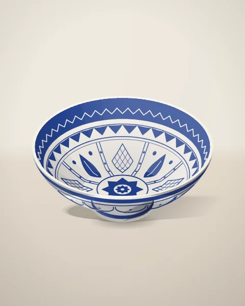 A deep footed bowl in white tin glaze, painted inside with a cobalt star medallion, radiating panels and a sawtooth border.