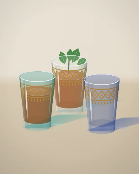Three small tea glasses with gilded borders on a linen cloth: two filled with amber tea, one of them topped with fresh mint, and an empty blue glass waiting to be poured.